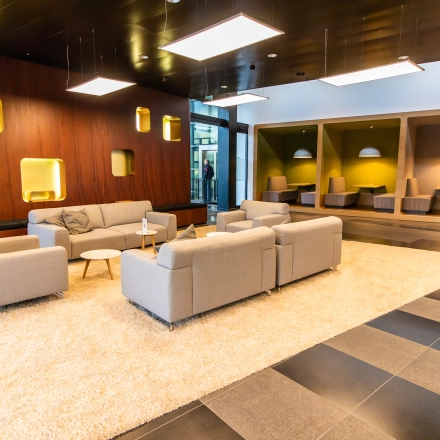 Modern furnished office space with cozy seating area, located at Jonkerbosplein 52 in Nijmegen. Ideal for office space rental.
