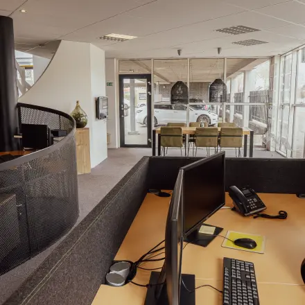 Spacious interior of an office to rent at Abdis van Thornstraat 74, Oosterhout Nb. Features modern workstations and ample natural light, ideal for productive office space rental.