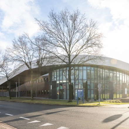 Exterior view of the modern office building at Veengang 1, Oosterwolde, available for office space rental.