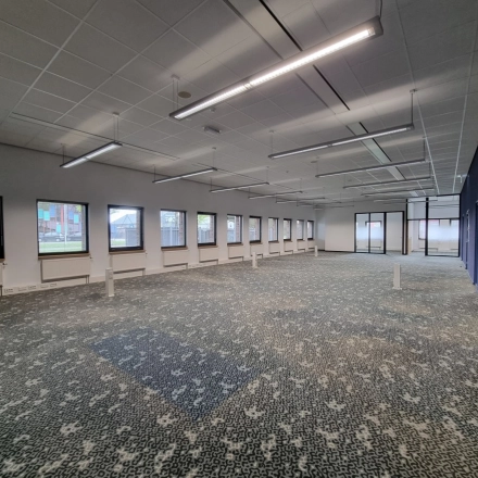 Bright office space at Veengang 1, Oosterwolde, featuring large windows and ample lighting, perfect for rent office space or office space rental needs.