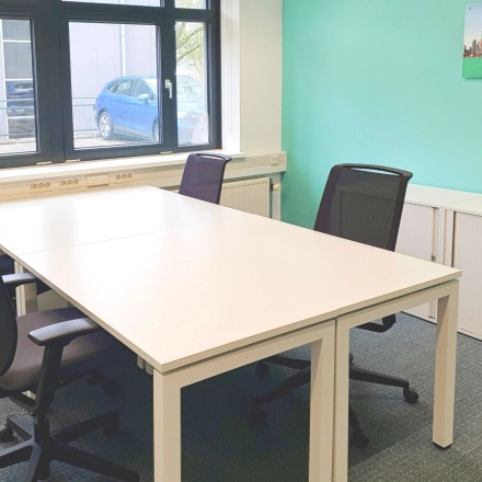 Bright office space at Einsteinlaan 28, Rijswijk, with modern furnishings perfect for office space rental, featuring a large window and ample seating options.
