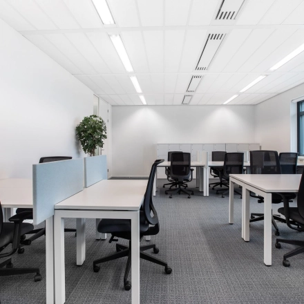 Modern office space for rent at Einsteinlaan 28, Rijswijk, featuring an open floor plan with desks and chairs, ideal for office space rental.