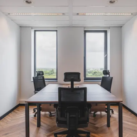 Office space at Laan van Zuid Hoorn 70, Rijswijk featuring a furnished room with modern chairs and a wooden table, ideal for office space rental.