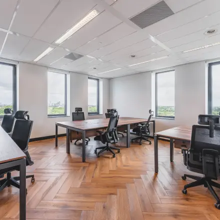 Spacious office to rent at Laan van Zuid Hoorn 70, Rijswijk, featuring modern furnishings and natural light from large windows, ideal for office space rental.