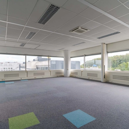 Spacious office to rent at Polakweg 7, Rijswijk, featuring large windows and an open floor plan ideal for office space rental.