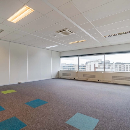 Bright office space at Polakweg 7, Rijswijk, featuring large windows with city views, suitable for office to rent.