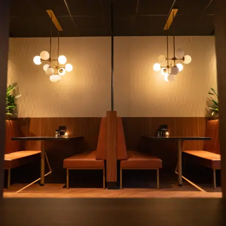 Cozy office space available for rent featuring intimate seating areas with stylish lighting and decor at George Hintzenweg 77-89 in Rotterdam Alexander.