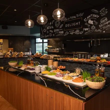 A well-equipped office pantry at George Hintzenweg 77 - 89, Rotterdam Alexander, offering a vibrant display of snacks and beverages, ideal for office space rental needs.