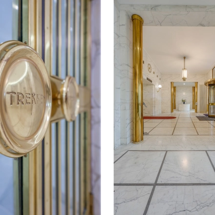 Elegant entrance with brass and marble accents at Blaak 34. Ideal spot for office space rental in Rotterdam Center.