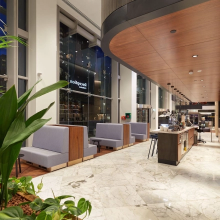 Spacious office at Blaak 555, Rotterdam Center, featuring modern furnishings and a well-lit open floorplan. Ideal for office space rental seekers.