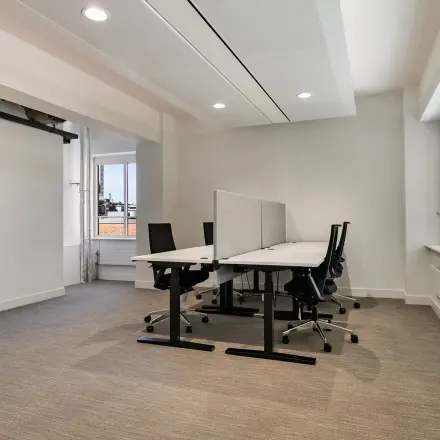 Bright, modern office space at Coolsingel 104, in Rotterdam Center, perfect for rent. Features natural light and sleek furnishings ideal for productive work sessions.