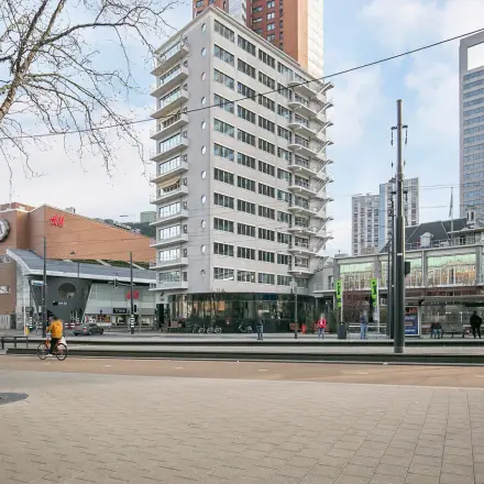 View of Coolsingel 104, Rotterdam Center showing surrounding business buildings, ideal for office space rental.