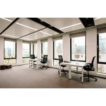 Bright office space at Coolsingel 65, Rotterdam Center with large windows and modern furnishings, perfect for office space rental.