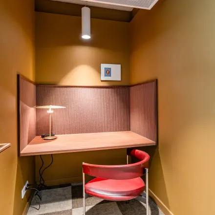 Compact furnished workspace available for office space rental at Stadhuisplein 9-23, Rotterdam Center.