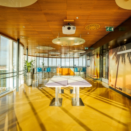 Spacious and modern office in Weena 70, Rotterdam Center with panoramic views and vibrant decor, ideal for office space rental.