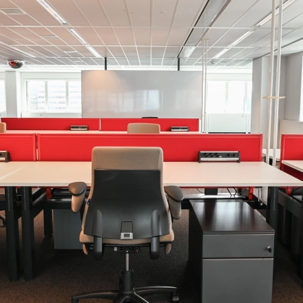 Spacious office to rent at Weena 70 in Rotterdam Center featuring organized workspaces with red dividers, ample natural light, and modern furnishings ideal for office space rental.