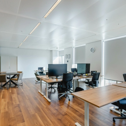 Furnished office space at Weena 788, Rotterdam Center, available for rent. The interior includes desks and chairs, perfect for workspace rental needs.