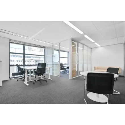 Spacious office to rent at Weena 290, Rotterdam Central Station with modern furniture, large windows, and ample natural light. Ideal for office space rental.