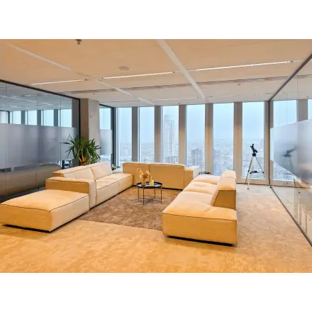 Spacious and modern lounge area in an office to rent at Wilhelminakade 173, Rotterdam Kop van Zuid, featuring comfortable seating and a city view, ideal for office space rental.