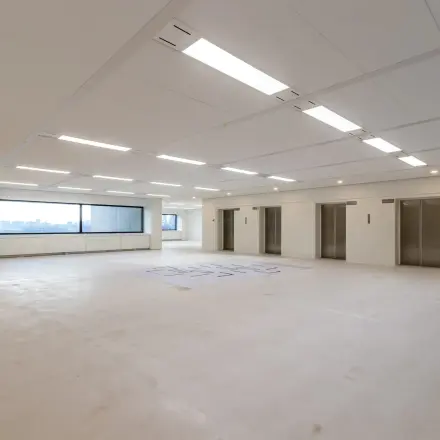 Spacious interior at Oostmaaslaan 71, Rotterdam Kralingen, ideal for office space rental with ample natural light and modern design.
