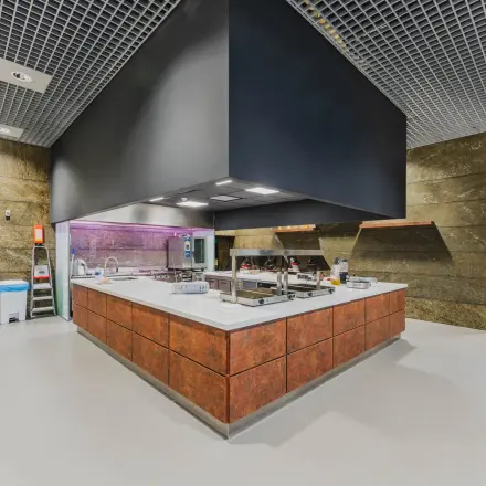 Modern kitchen area in an office space with ample counter area and contemporary design, located at Oostmaaslaan 71 for office space rental.