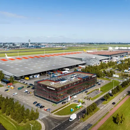 Aerial view of office space at Folkstoneweg 2-56, Schiphol Airport, surrounded by parking and industrial facilities.