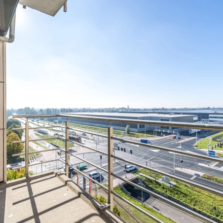 Exterior view from Beechavenue 54-100, Schiphol Rijk, showcasing a balcony overlooking roads and buildings, ideal for office space rental.