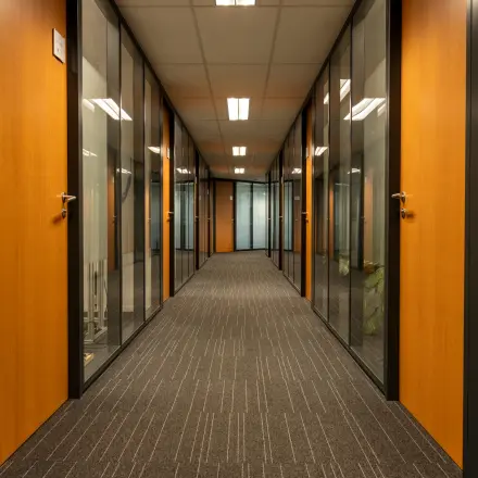 Hallway at Curieweg 9, Spijkenisse, featuring several office doors ideal for office space rental.