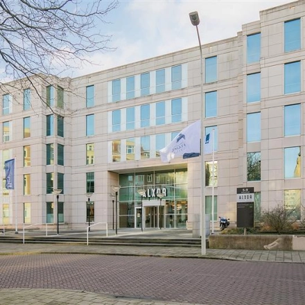 Exterior view of the Alexanderveld 5-9 office building in The Hague Center, highlighting modern design and ample windows. Ideal for office space rental.