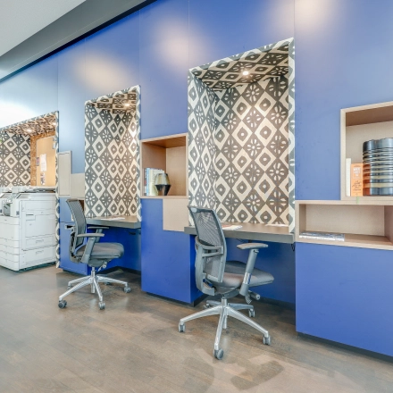 Modern office space with stylish blue accents and furnished workstations, available for rent office space at Kalvermarkt 53 in The Hague Center.
