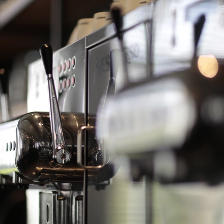 Close-up of coffee machines in an office space available for rent at President Kennedylaan 19, The Hague Statenkwartier.