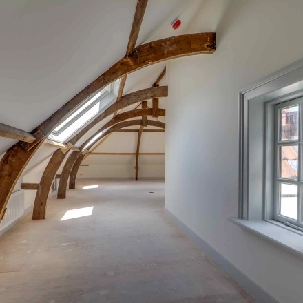 Spacious office to rent at Brigittenstraat 22, Utrecht Center featuring exposed wooden beams and ample natural light, ideal for flexible office space rental.