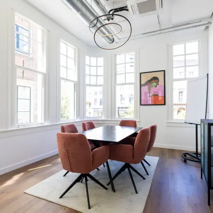 Bright office to rent at Oudegracht 161, Utrecht Center, featuring modern furniture and large windows, perfect for office space rental.