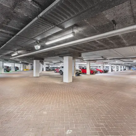 Spacious parking area at the office building on Leidseveer 2-10, Utrecht Central Station, suitable for easy access to office space rental.