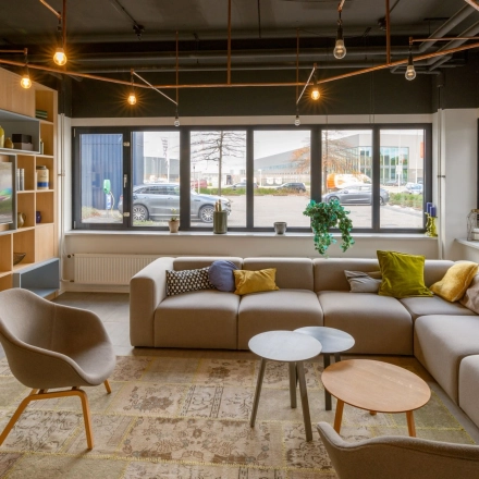 Comfortable and modern furnished workspace at Atoomweg 400, Utrecht Lage Weide. Perfect office space rental with cozy seating and large windows offering ample natural light.