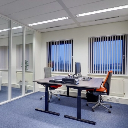 Bright, furnished office space for rent at Atoomweg 63, Utrecht Lage Weide, featuring modern desks and chairs, ideal for business activities.