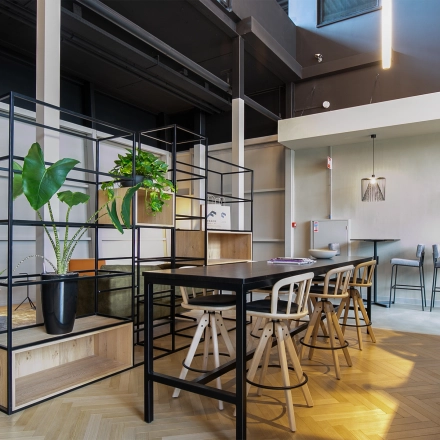 Modern office space with sleek furnishings and green plants at Atoomweg 63 in Utrecht Lage Weide, suitable for those seeking office space rental.