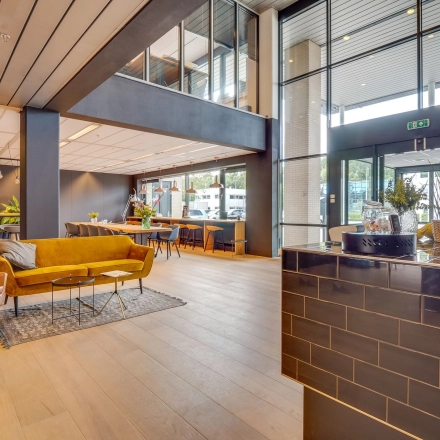 Modern office space with stylish seating and natural light, ideal for office space rental at Computerweg 22, Utrecht Lage Weide.