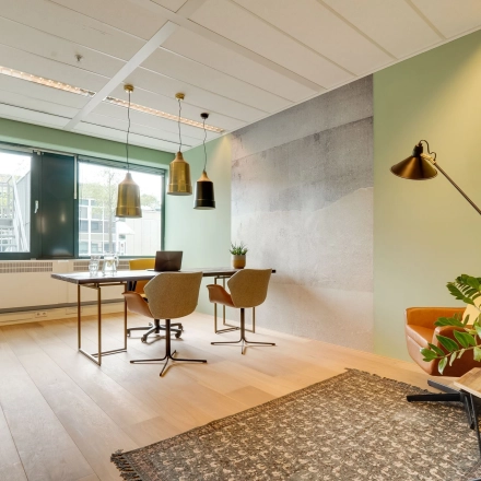 Modern office space with a large window, minimalist decor, and stylish lighting at Computerweg 22, Utrecht Lage Weide, perfect for office space rental.