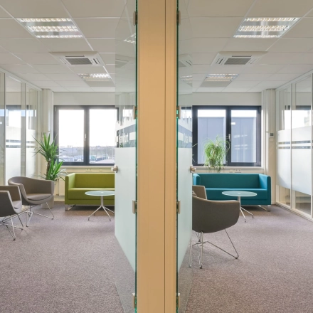 Bright office space at Kobaltweg 11, Utrecht Lage Weide, featuring modern furnishings and large windows for natural light. Ideal for those looking to rent office space with ample seating.