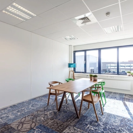Bright furnished office space at Reactorweg 301, Utrecht Lage Weide, featuring a table, chairs, and natural light, suitable for office space rental.