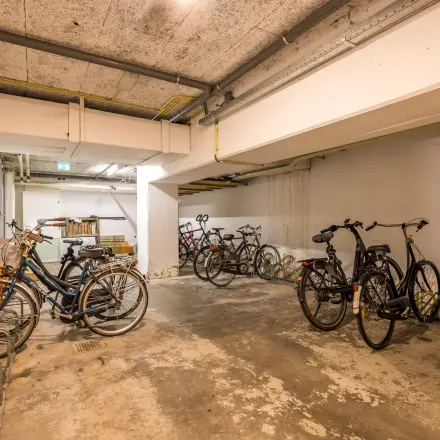 Basement bike storage area for office space rental at Goeman Borgesiuslaan 77, Utrecht North.