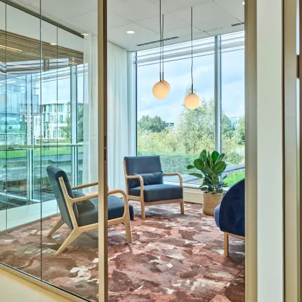 Furnished office space at Van Deventerlaan 30-40, Utrecht Papendorp, featuring modern chairs and a glass partition with natural lighting.