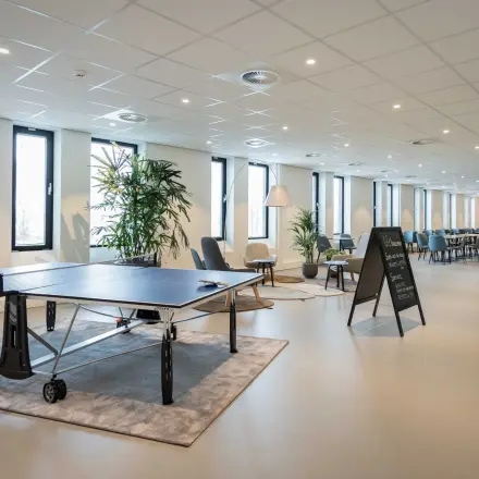Spacious and modern furnished office interior in Utrecht Papendorp with a meeting area and leisure facilities, perfect for office space rental.