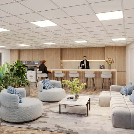 Modern office space with stylish furnishings, featuring a sitting area and people engaging in a meeting, located at Newtonlaan 115, an ideal office to rent in Utrecht Rijnsweerd.