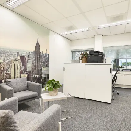 Office space at Winthontlaan 200, Utrecht South featuring comfortable seating and office equipment, available for rent. Bright workspace with modern decor ideal for business activities.