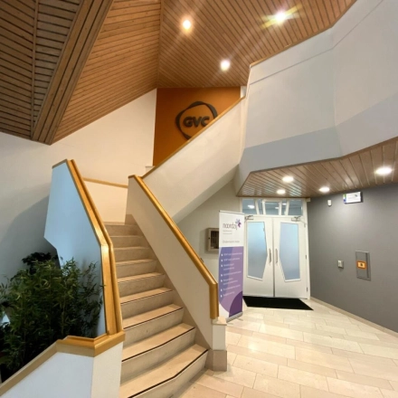 An inviting entrance at Loire 104 - 206, Voorburg, perfect for your next office space rental. Stylish indoor architecture leads to rentable spaces above.