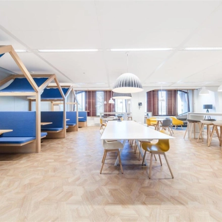 Bright office space for rent in Voorburg at Loire 104 - 206, featuring modern furnishings and collaborative workspaces with ample seating and natural light.