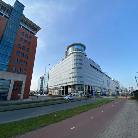 Exterior view of a modern office building at Regulusweg 11, Voorburg, ideal for office space rental.