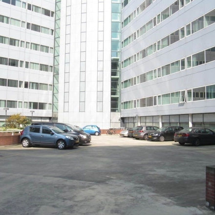 Parking area of the office building at Regulusweg 11 in Voorburg, suitable for those seeking convenient office space rental.